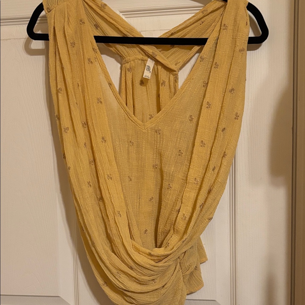 Free people. This is a pretty piece. She drapes in the front.